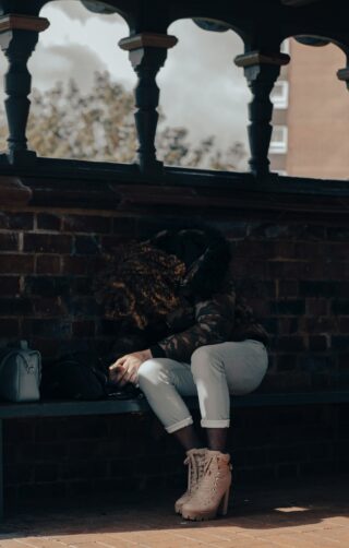 “Person reflecting quietly, symbolizing depression and hope.”